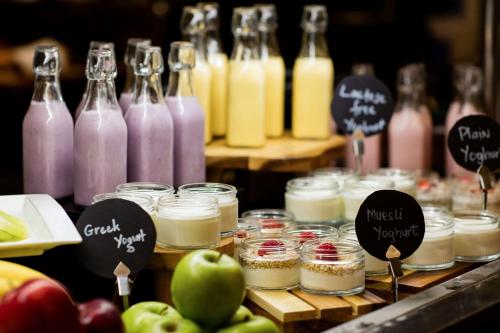 a display of jars of different types of drinks at The Diplomat Radisson Blu Hotel Residence & Spa in Manama