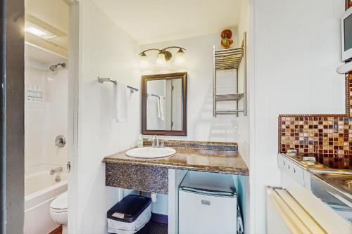 a bathroom with a sink and a mirror at Seashore Escape in North Truro