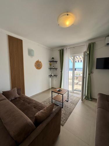 a living room with a couch and a table at Apartments Villa Marija in Petrovac na Moru