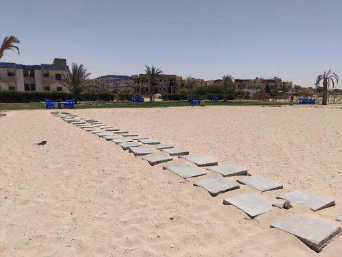a row of stepping stones on a sandy beach at Home in ras sedr in Ras Sedr