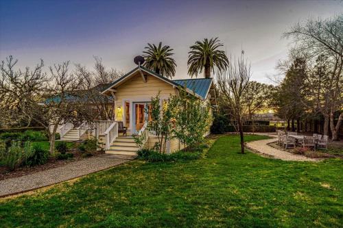 a small house with a porch and a yard at Starlite Vineyard Escape in Geyserville
