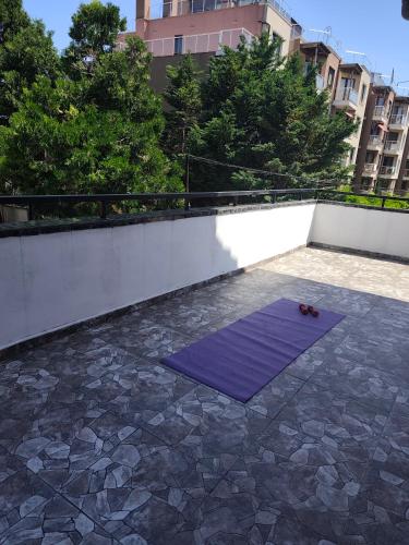 a purple yoga mat on top of a balcony at Bo's place in St. St. Constantine and Helena