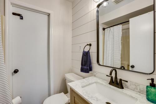 a bathroom with a sink and a mirror at Hike, Fish and Explore Lakefront Cottage in Baldwin in Baldwin