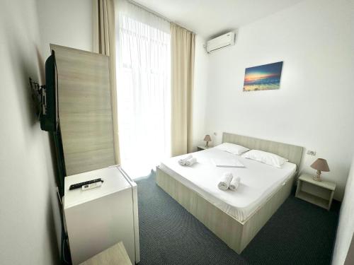 Katil atau katil-katil dalam bilik di Neptun Resort