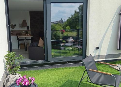 a room with a sliding glass door with a patio at Sweet Dreams in Visé