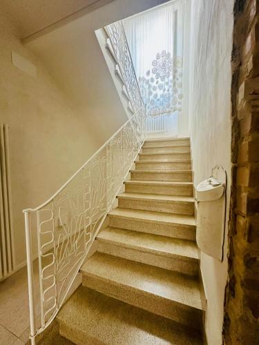 a staircase in a home with a white railing at La Presentosa b&b in Fossacesia