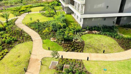 an aerial view of a building with a garden at Minissy luxury Serviced Apartment in Moka