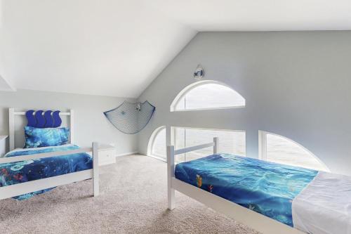 a bedroom with two bunk beds and a window at The Whole Ship in Clinton