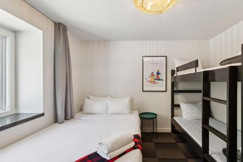Postel nebo postele na pokoji v ubytování Auberge Manitonga