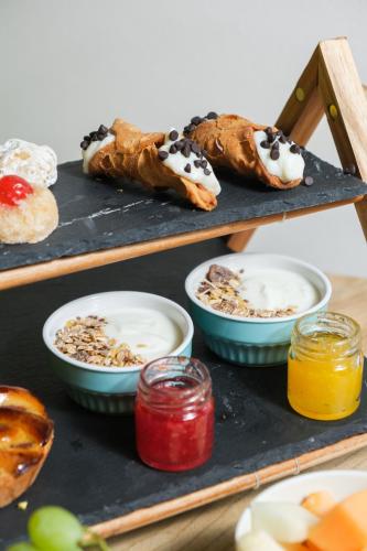 a tray with pastries and other food on it at Expa in Palermo