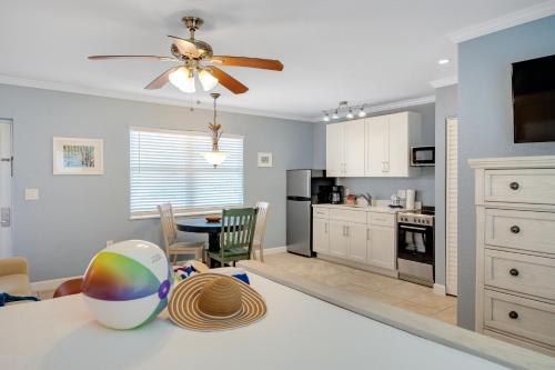 a kitchen and dining room with a ceiling fan at Tropical Beach Resorts - Sarasota in Sarasota