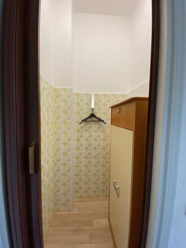 a hallway with a door leading to a bathroom at Albergo Lodrino in Villa