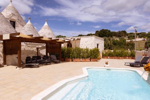 The swimming pool at or close to Quei Trulli Divini