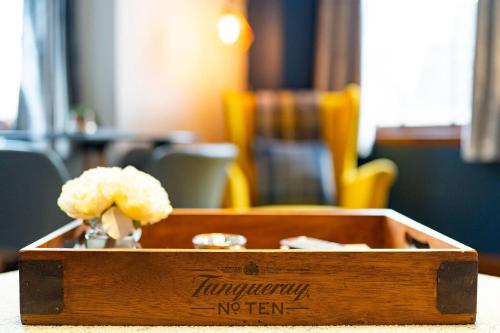 a wooden box with flowers in it on a table at The Tollbooth in Clackmannan