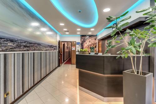 a lobby of a building with a blue ceiling at Hotel Ottaviano Augusto in Rome