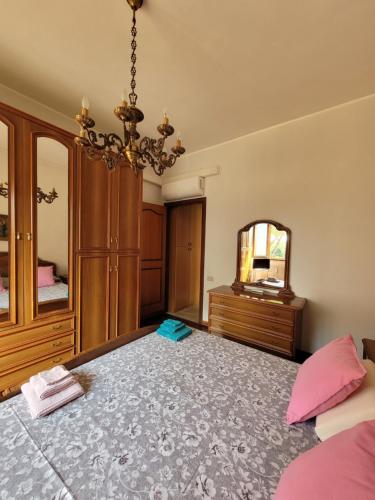 a bedroom with a bed and a mirror at Panoramico Eur in Rome