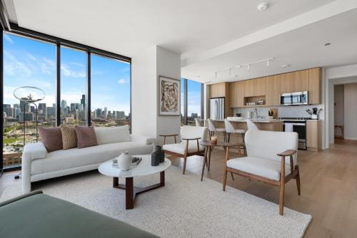 a living room with a view of a city at Foundry Unmatched Skyline Views at Lincoln Park in Chicago