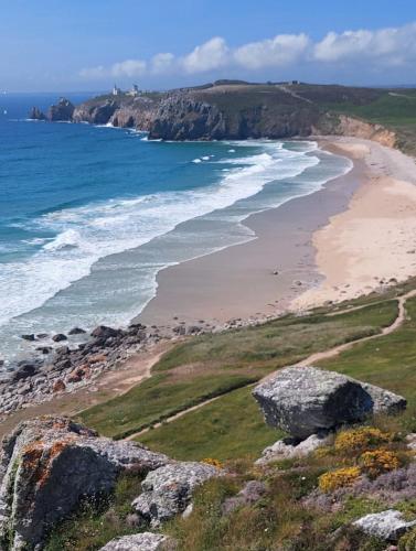a view of a beach and the ocean at Ty laouen in Crozon