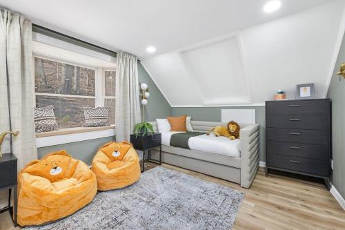 a bedroom with two ottomans and two beds in it at Mtn Views, Game Room, Pet Friendly! in Seven Devils