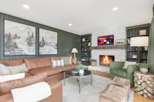 a living room with a couch and a fireplace at Mtn Views, Game Room, Pet Friendly! in Seven Devils