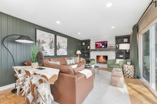 a living room with a couch and a fireplace at Mtn Views, Game Room, Pet Friendly! in Seven Devils