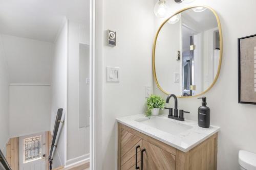 a bathroom with a sink and a mirror at Mtn Views, Game Room, Pet Friendly! in Seven Devils