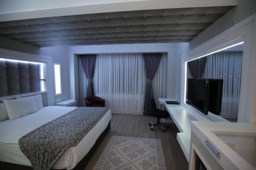 Cama o camas de una habitación en Seckin Hotel