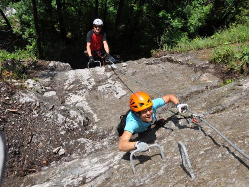 a person is on a rock climbing ape at Caroline's Appartement in Au im Bregenzerwald