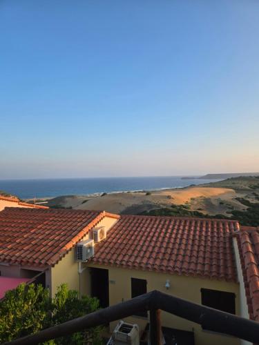 a view of the ocean from the balcony of a house at Golden Dune View in Torre Dei Corsari