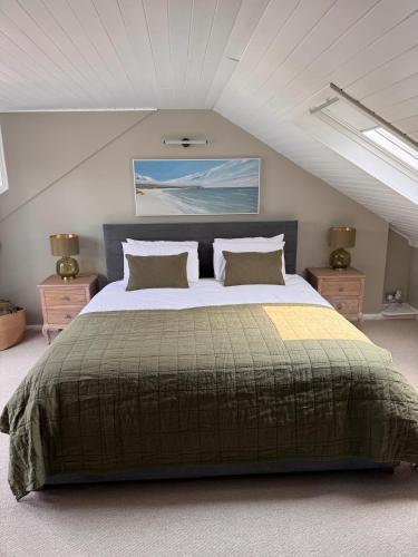 a bedroom with a large bed in a attic at Saviours View in Dartmouth