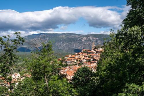 a small town on a hill in the mountains at Elsea in Vernet-les-Bains