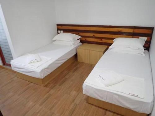 Кровать или кровати в номере Eveylaa Guesthouse