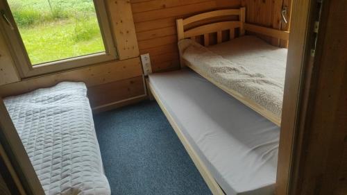 two bunk beds in a room with a window at Lavender Retreat in Kraków