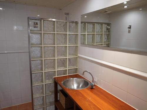a bathroom with a sink and a mirror at Casa a Solric con piscina compartida, 3 habitaciones, cerca de L'Estartit y playas - ES-323-40 in L'Estartit