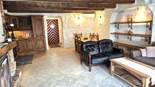 a living room with a couch and a table at Deluxe Apartments in the city center with Balcony in Pärnu