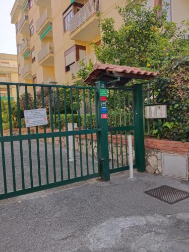 a gate with a sign in front of a building at A I R Sorrento House 2 in Sorrento