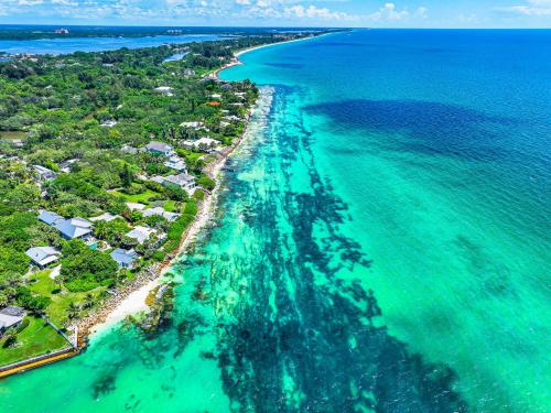 an aerial view of a beach with houses and the ocean at Bianco Sands By Beachside Management in Siesta Key