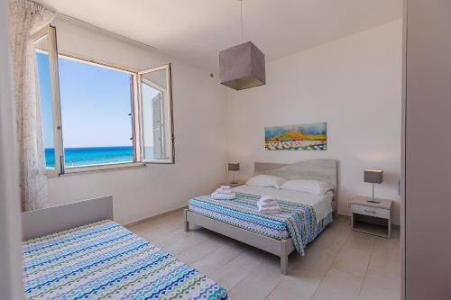 Katil atau katil-katil dalam bilik di Brezza di tramontana