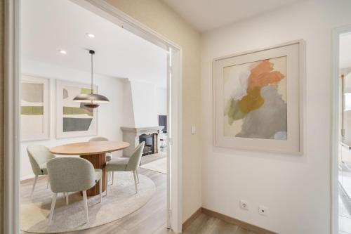 a dining room with a table and chairs at Penthouse Praia de Olinda - Minho's Guest in Vila do Conde