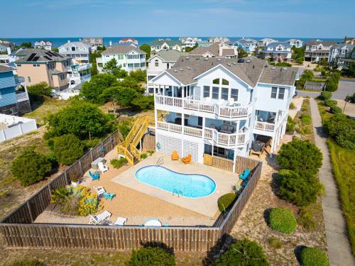 an aerial view of a large house with a swimming pool at Steps to Beach Pool Game Room Aug Weeks Open in Corolla