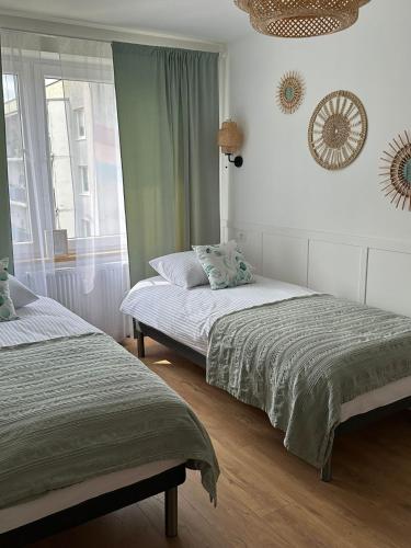 Ένα ή περισσότερα κρεβάτια σε δωμάτιο στο Boho Przystań Mikołajki - Idealny dla Ciebie
