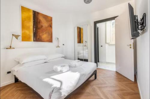 Giường trong phòng chung tại Milano Suites