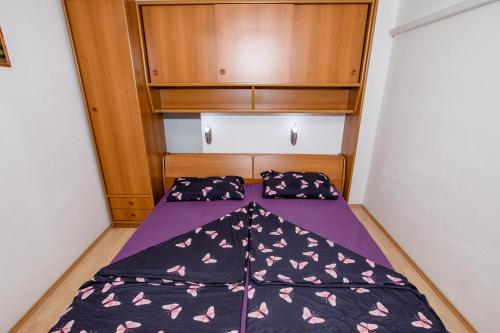 Katil atau katil-katil dalam bilik di Apartments Jug