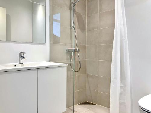 a bathroom with a shower and a sink at Convenient Apartment for 2 in Aarhus
