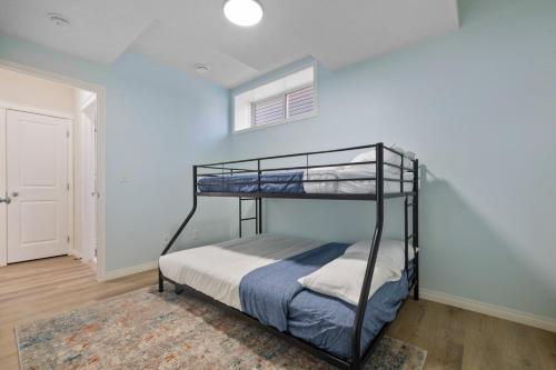 a bedroom with a bunk bed and a window at The Ultimate Getaway with Central AC, 3 King Beds, Hot Tub, Pool Table and More in Balzac