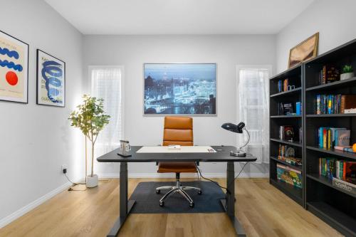 an office with a desk and a chair and bookshelves at The Ultimate Getaway with Central AC, 3 King Beds, Hot Tub, Pool Table and More in Balzac