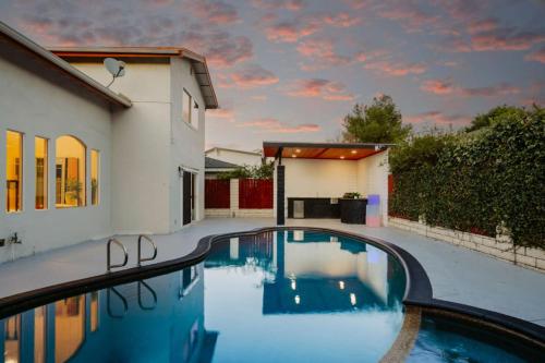 a swimming pool in the backyard of a house at Designer Dream- Pool and spa- Game Room- Sleeps 10 in Los Angeles