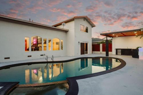 a swimming pool in front of a house at Designer Dream- Pool and spa- Game Room- Sleeps 10 in Los Angeles