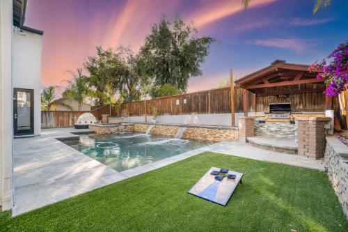 a backyard with a swimming pool and a fire place at King Bed Temecula Getaway Amazing Pool and Theatre in Murrieta