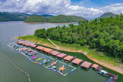an aerial view of a dock with boats in the water at เดอะวอเตอร์ปาร์ครีสอร์ท- The Water Park Resort in Ban Laem Mong Khoi